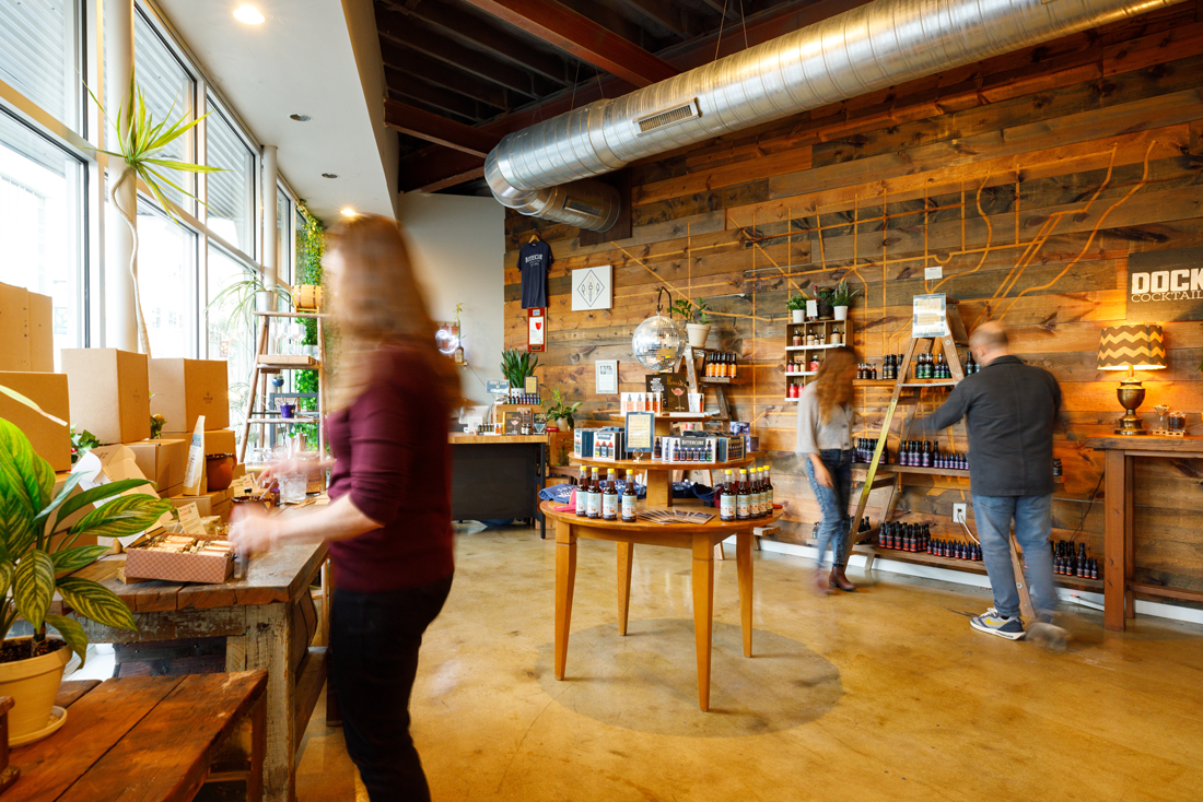 A wide shot of the apothecary bazaar with people shopping